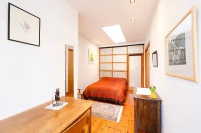 a bedroom with a bed and a desk at Edinburgh New Town Deluxe Apartment with Terrace in Edinburgh