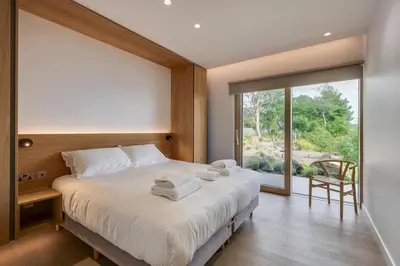 a bedroom with a large bed with towels on it at 4 Bed in Cove oc-r31840 in Cove