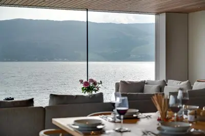 a dining room with a view of the water at 4 Bed in Cove oc-r31840 in Cove