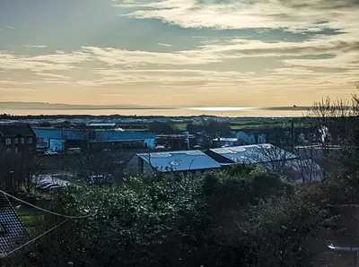 a view of a city with a body of water at The Old High Road, North Ayrshire in Stevenston