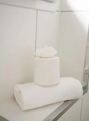 a stack of towels on a shelf in a bathroom at The Rise Retreat in Livingston