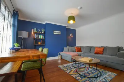 a living room with a couch and a table at Homely 2 Bed House with Private double driveway in Oban