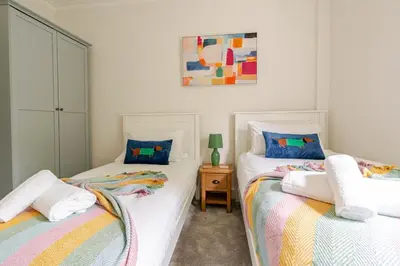 two beds sitting next to each other in a bedroom at Amulree, Edinburgh City in EDI