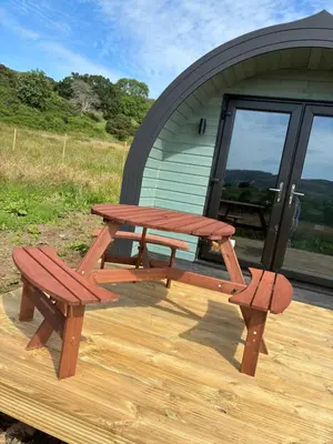 a picnic table and a bench sitting on a deck at Lerags glen farm pods in Lerags