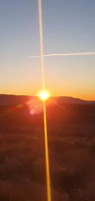an image of the sunset from an airplane at Edenmill Farm in Glasgow