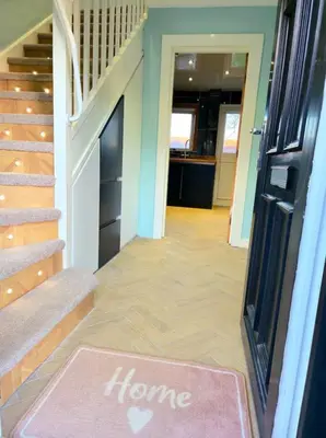 a home entrance with a welcome mat on the floor at Super luxury 2 bedroom, full house sleep 5 with garden & parking close to airport in Elderslie