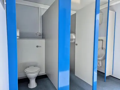 a bathroom with a white toilet and a sink at The Hideouts at Port nan Gael Campsite in Pennyghael