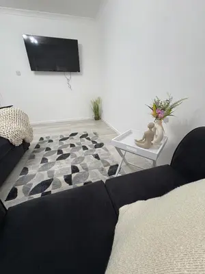 a living room with a couch and a table at Cozy 3 Bed Home, Free Parking 8 min to City Centre in Cowlairs