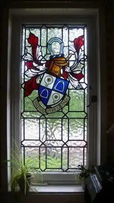 a stained glass window with a vase on it at Sandilands House in Edinburgh