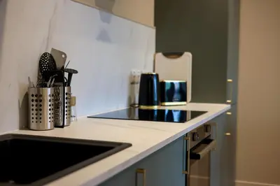 a kitchen with a sink and a counter top at Netherbrae Apartment in Oban