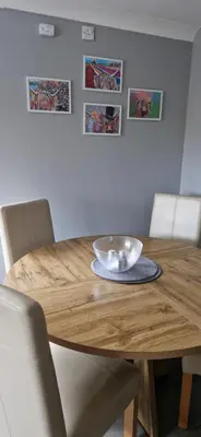 a wooden table with a bowl on top of it at The Cottage in Kirk of Shotts