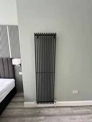 a radiator in the corner of a room at The Dixon - Commonwealth Games 2026 in Glasgow