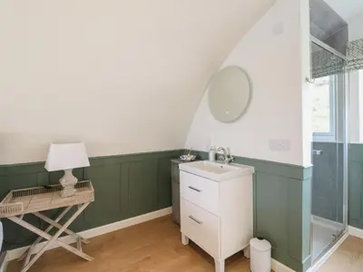 a bathroom with a sink and a mirror at Sula in Oban