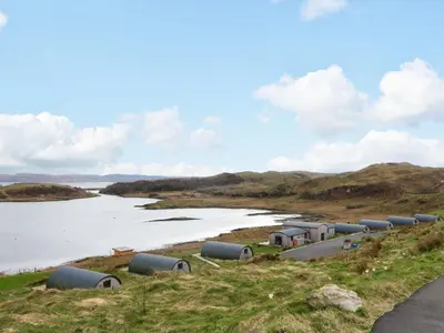 a row of pipes on the side of a river at Torsa in Oban
