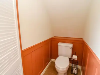 a small bathroom with a toilet in the corner at Fladda in Oban