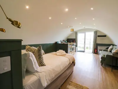 a bedroom with a large bed in a room at Insh in Oban