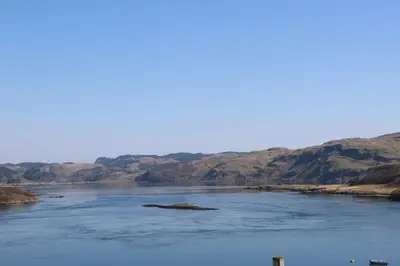 a large body of water with a island in it at Losal in Oban
