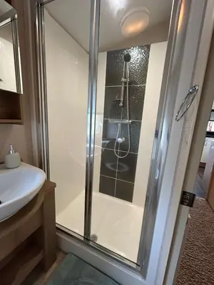 a bathroom with a shower and a sink at New Hampton 36 in Dunoon