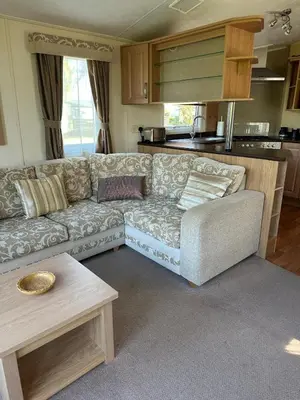 a living room with a couch and a table at The Grosvner 61 in Dunoon