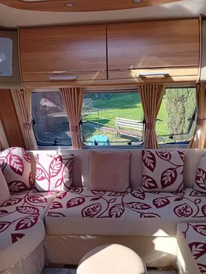 a couch in the back of a camper van at Railway cottage caravan in Oban