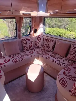 a couch in the back of a camper van at Railway cottage caravan in Oban