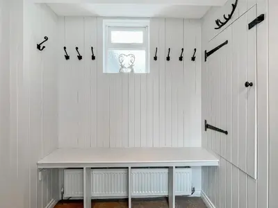a white bench in a room with a window at Ardvenhor in Gartocharn