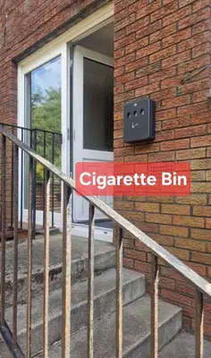 a sign on the side of a brick building at My Glasgow House Robroyston in Hogganfield