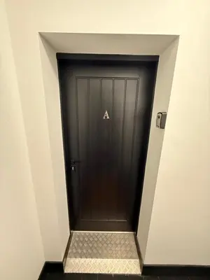 a black door with aaa on it in a building at GlasVenn Cottages in Irvine