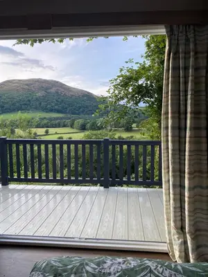 a balcony with a view of a wooden deck at The View in Ballantrae