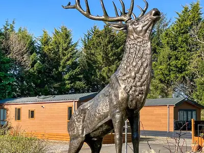 a statue of a deer with its head in the air at Burnside Lodge in Auchterarder