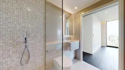 a bathroom with a shower with a toilet and a sink at 2b2b skyline flat&amazing view! in Moffat