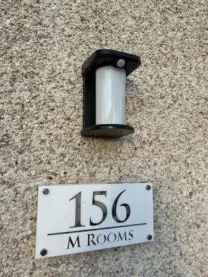 a street light on the side of a building at Flat 156 at M Rooms in Shotts Station