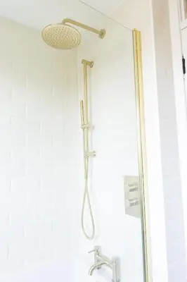a shower with a shower head in a bathroom at Birchgate Bothy - Spacious 4 Bedroom Home in Dunoon in Dunoon