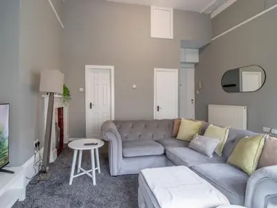 a living room with a couch and a table at Pass the Keys West End Wonder in Glasgow