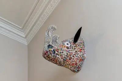 a mask hanging on a wall next to a ceiling at Haymarket Apartments in Edinburgh