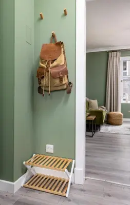 a room with a pile of luggage on the wall at Ochill View Apartment by Stirling Train Station in Stirling