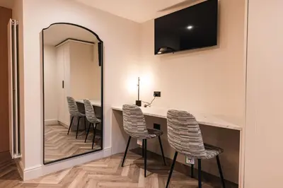 a waiting room with chairs and a mirror at Luxury Georgian Aparthotel by Hauss Ayr - 5mins to Beach, Town Centre! in Ayr