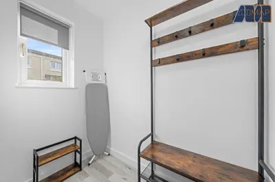 a bedroom with a bunk bed and a window at 3BR Home in Kilmarnock Sleeps 6 in Kilmarnock