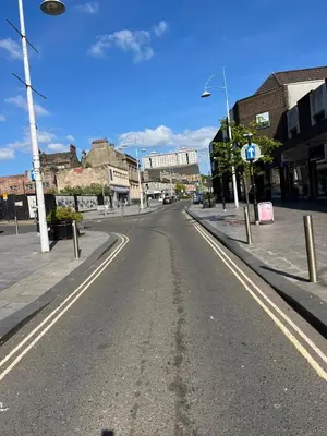 an empty street in a town with buildings at Coatbridge central apartment 20 min from Glasgow in Coatbridge