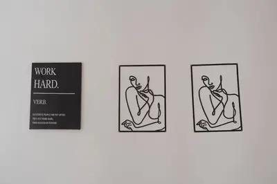 a group of three framed illustrations of a man sitting at Stylish 3BR Stay by Hampden No 161 with Free Parking in Glasgow