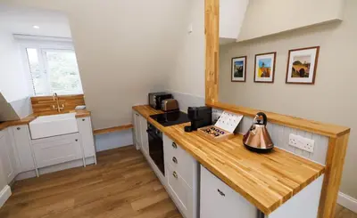 a kitchen with a counter with a tea kettle on it at Cosy Apartment in the Heritage Quarter - Sleeps 2 in Dunfermline