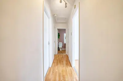 a hallway with a toilet in a room at 2BR Flat Parking Near City and Finnieston in Glasgow