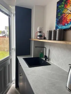 a kitchen with a sink and a counter top at Modern flat in quiet residential cul-de-sac in Kilwinning