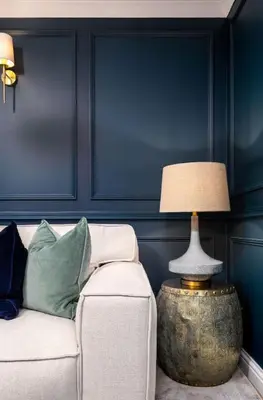 a living room with a couch and a lamp at Sapphire Suite, The Stirling Residence in Stirling
