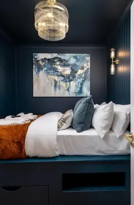 a bedroom with a large white bed with pillows at Sapphire Suite, The Stirling Residence in Stirling