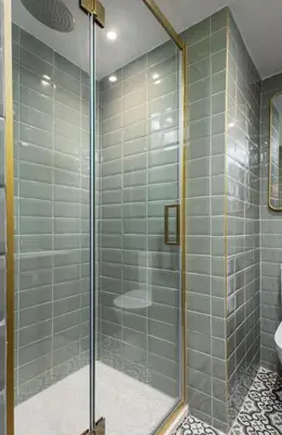 a shower with a glass door in a bathroom at Bridgend Studio - Near Free Parking in Stirling