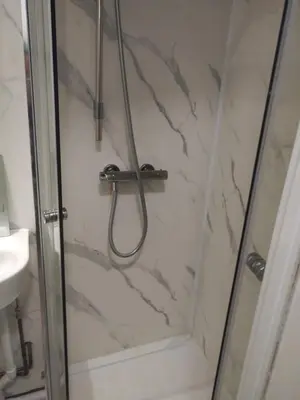 a bathroom with a shower with a glass door at 98 Board street in Moffat