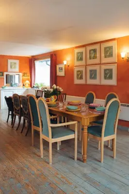 a dining room with a wooden table and chairs at Ardtalnaig House, Loch Tay in Ardtalnaig