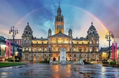 a large building with a rainbow in front of it at Stylish Central Flat George Sq in Glasgow
