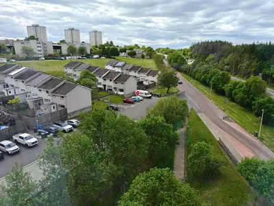 an aerial view of a city with houses and a street at Modern 2 Bed Flat in East Kilbride